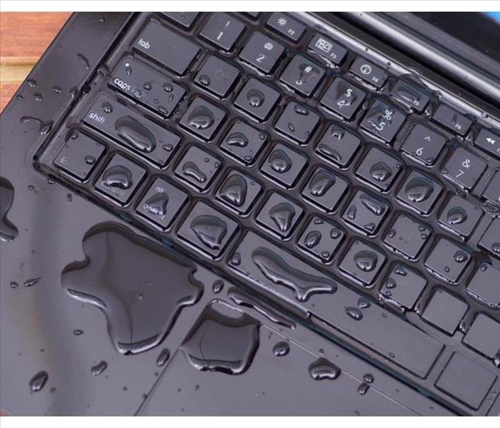 Keyboard of a computer spilled with water.